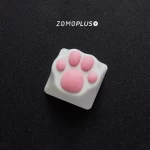 Add a touch of character to your keyboard with this tactile and visually appealing ABS & Silicone White-Pink Kitty Paw Artisan Keycap, perfect for F and J homing keys.