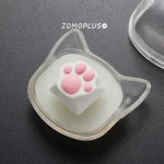 ZOMOPLUS White-Pink Kitty Paw Keycap with a matching cat-face storage box. Perfect for storing, displaying, and adding charm to your setup.