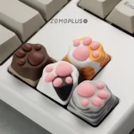 Custom kitty paw keycaps in orange, Siamese, and American shorthair designs, offering a fun and unique tactile typing experience for your keyboard.