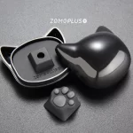 ZOMOPLUS kitty paw keycap alongside its adorable storage box, making it a perfect gift for cat lovers and tech enthusiasts.