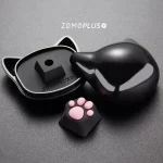 ZOMOPLUS black-pink kitty paw keycap displayed with a fun cat face storage box, designed to keep your keycaps safe and stylish.