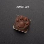 Intricate details of the ZOMOPLUS Siamese Cat Paw Keycap, showcasing its softness and unique color patterns.