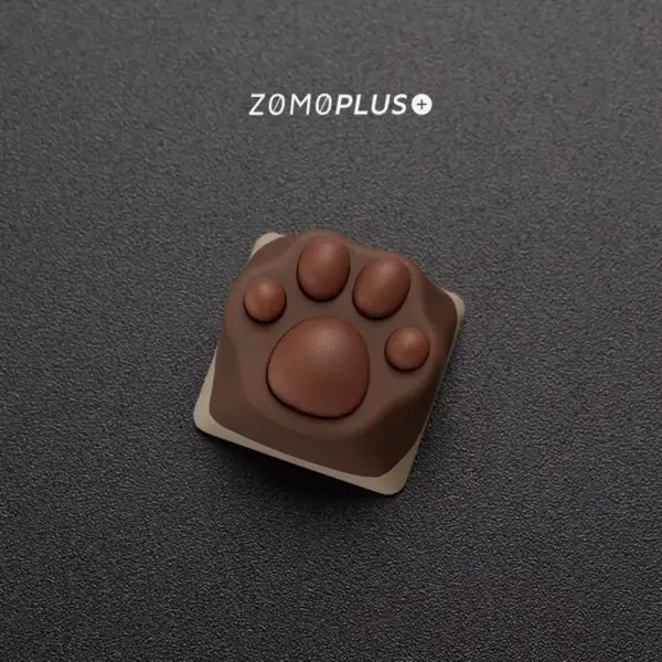 Intricate details of the ZOMOPLUS Siamese Cat Paw Keycap, showcasing its softness and unique color patterns.