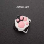 Up-close view of the adorable Tuxedo Cat paw keycap from ZOMOPLUS, emphasizing its vibrant colors and soft touch.