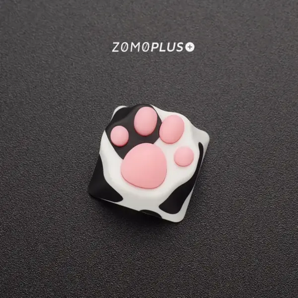 Up-close view of the adorable Tuxedo Cat paw keycap from ZOMOPLUS, emphasizing its vibrant colors and soft touch.