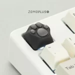 ZOMOPLUS black-grey kitty paw keycap enhances your keyboard's look while providing a playful touch.