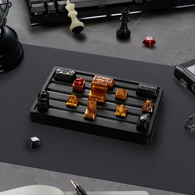 ZOMOPLUS X BUGERWORK keycap storage box on desk, with artisan keycaps displayed neatly. Ideal for organized storage.