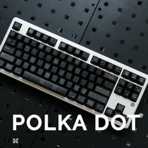 Complete mechanical keyboard with black polka dot keycaps installed, white keyboard frame, professional gaming setup