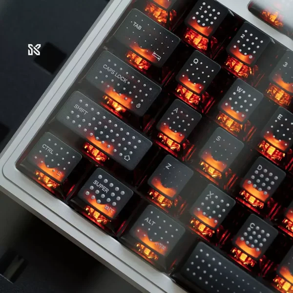 Black polka dot translucent keycaps with bright orange RGB backlighting on mechanical keyboard, premium gaming setup